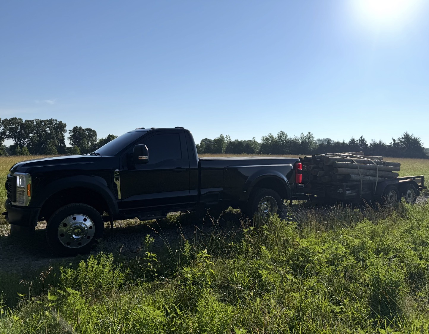 Truck and trailer with materials in a field