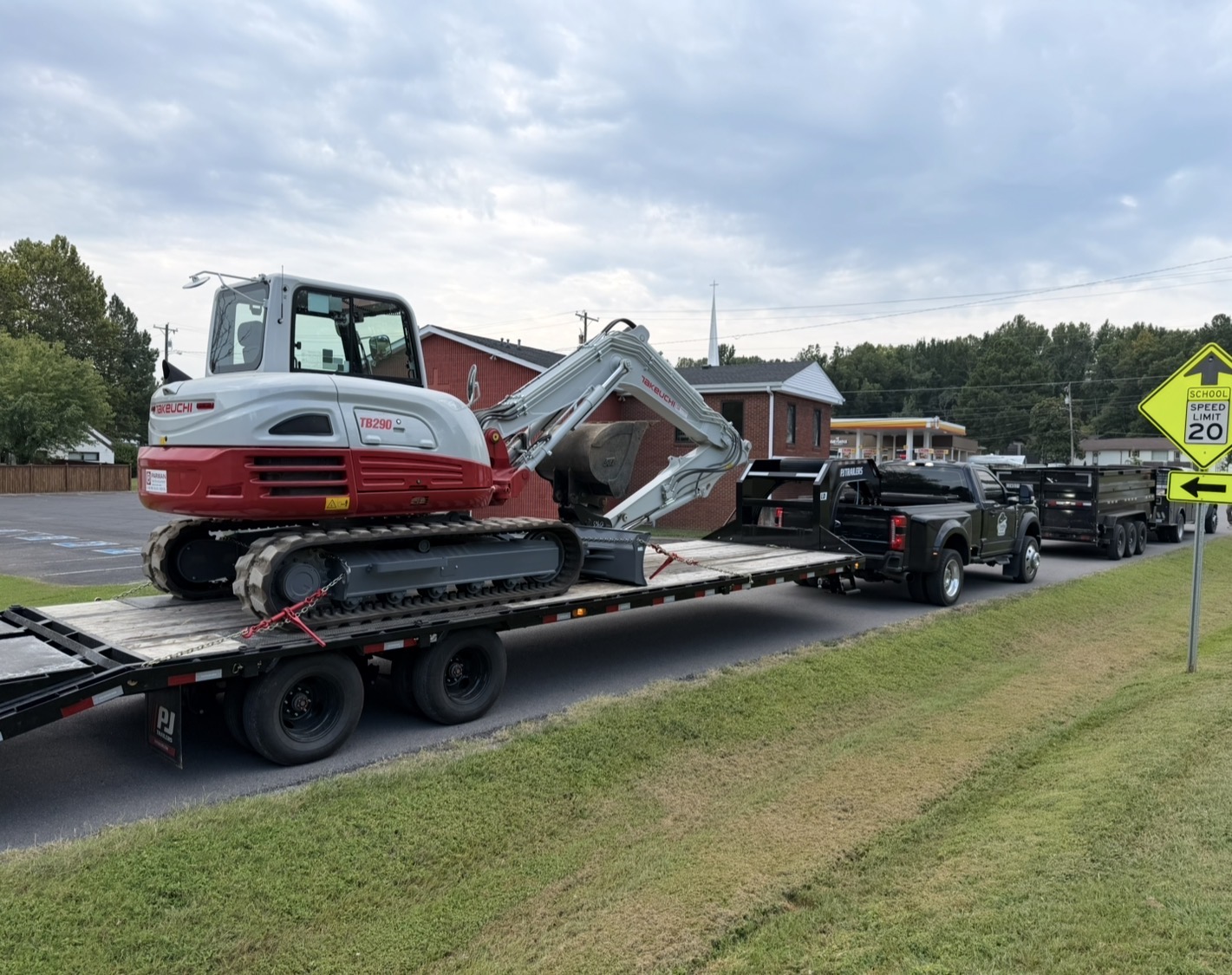Cowboy Crown truck and equipment hauled to a job site