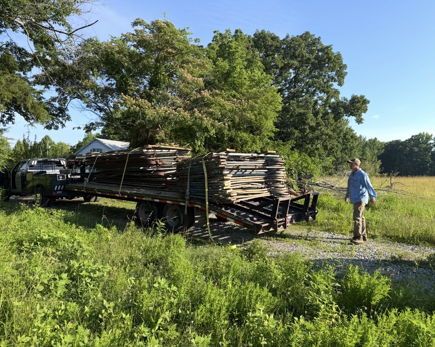 Trailer loaded with materials in a grassy field